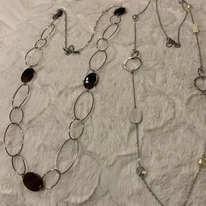 2 long necklaces.Silver tone with some beads.